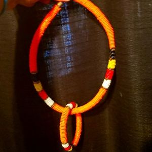 Beaded neckless and bracket